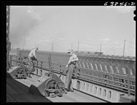 Loading ore boat. Levers control chutes which extend from bins where ore is stored. Allouez, Wisconsin. Sourced from the Library of Congress.