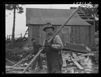 [Untitled photo, possibly related to: Kalispell, Montana. Rolling logs into the pond at FSA (Farm Security Administration) cooperative sawmill]. Sourced from the Library of Congress.