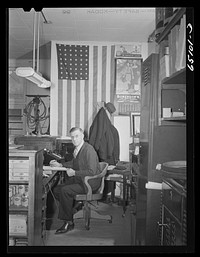 Williston, North Dakota. Mr. Dahlen hardware merchant, in his store. He is the county chairman for the defense saving campaign. Sourced from the Library of Congress.