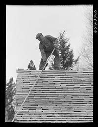 [Untitled photo, possibly related to: Flathead Valley special area project, Montana. Stacking board lumber at the cooperative sawmill. This mill is operated by FSA (Farm Security Administration) borrowers, most of whom have moved to Flathead County in recent years from the drought area of eastern Montana and the Dakotas]. Sourced from the Library of Congress.