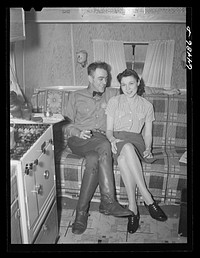 Burlington, Iowa. Acres unit, FSA (Farm Security Administration) trailer camp. Mr. and Mrs. Barker in their trailer by John Vachon