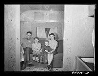 [Untitled photo, possibly related to: Burlington, Iowa. Acres unit, FSA (Farm Security Administration) trailer camp. Barker family in their trailer]. Sourced from the Library of Congress.