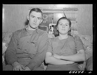 [Untitled photo, possibly related to: Burlington, Iowa. Sunnyside unit of FSA (Farm Security Administration) camp. Simmons family in their trailer for workers at Burlington ordnance plant]. Sourced from the Library of Congress.
