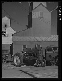 Dawson, Minnesota. Farmer inspecting a tractor. Sourced from the Library of Congress.