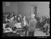 Williston, North Dakota. Farmers' union meeting with the county commissioners to protest the selling of land to corporation farms in Williams county and to discuss the protection of the family-size farm. Sourced from the Library of Congress.