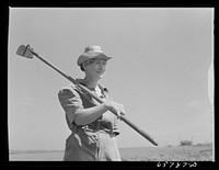 [Untitled photo, possibly related to: Lancaster County, Nebraska. Mrs. Thelander, FSA (Farm Security Administration) borrower, working in her garden]. Sourced from the Library of Congress.