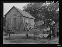 A shallow well in a barn lot is dangerous. Safe well demonstration near La Plata, Maryland. Charles County. Sourced from the Library of Congress.