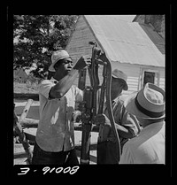 Pump head is assembled before attaching to pump rod. John Fredrick well project, Saint Mary's County, Maryland. Sourced from the Library of Congress.