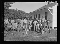 A Ridge project family and neighbors made a real holiday of the installation of the new well. Saint Mary's County, Maryland. Sourced from the Library of Congress.