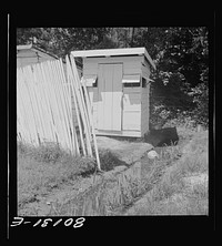 Drainage ditch runs under privy and down to house. Good drainage site for privy would have avoided this health hazard. Saint Mary's County, Maryland. Sourced from the Library of Congress.