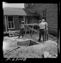 [Untitled photo, possibly related to: Windlass lifts cement wall from well. John Hardesty well project, Charles County, Maryland]. Sourced from the Library of Congress.