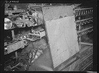 Cans, after sterilizing in steam, travel in conveyor belt to canning room. Phillips Packing Company, Cambridge, Maryland. Sourced from the Library of Congress.