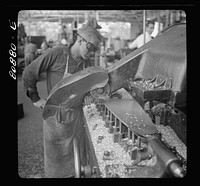 [Untitled photo, possibly related to: Profiler shaping the curve of propeller blade. Hamilton Propeller plant. East Hartford, Connecticut]. Sourced from the Library of Congress.