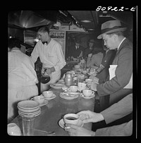 Commuters on train to New York City. Dining car counter. Sourced from the Library of Congress.