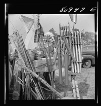 Machine-made arrows and sporting store bows were for sale at some of the stands. Local Indian association-sponsored Indian fair. Windsor Locks, Connecticut. Sourced from the Library of Congress.