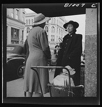 Women talk. Street scene at Holyoke, Massachusetts. Sourced from the Library of Congress.