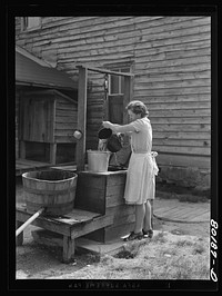 The dug well before repair. The water will be safe for drinking if surface water, insects, animals and dirty containers can be kept out of it. John Hardesty well project, Charles County, Maryland. Sourced from the Library of Congress.