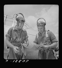 Flight instructors E.E. McTaggart and J.C. Gumison chart the day's flight. Craig Field, Southeastern Air Training Center, Selma, Alabama. Sourced from the Library of Congress.