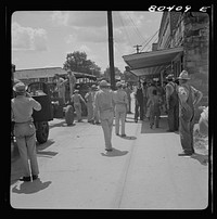 It's good to put your feet down on your own home street. Home guard passes through Enterprise, Coffee County, Alabama. Sourced from the Library of Congress.