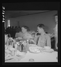 [Untitled photo, possibly related to: "Like real home-cooked chicken" say these Craig Field flying cadets, in praise of the tender FSA (Farm Security Administration) "Food for Defense" chickens. Craig Field, Southeastern Air Training Center, Selma, Alabama]. Sourced from the Library of Congress.