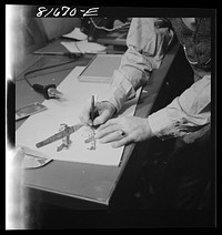 Washington, D.C. Preparing the defense bond sales photomural, to be installed in the Grand Central terminal, New York, in the visual unit of the FSA (Farm Security Administration). Milton Tinsley mounting part of the dummy. Sourced from the Library of Congress.