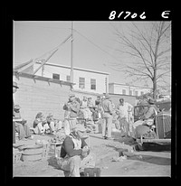 [Untitled photo, possibly related to: Workmen at lunch hour on emergency office space construction job. Washington, D.C.]. Sourced from the Library of Congress.