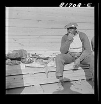 [Untitled photo, possibly related to: Workmen at lunch hour on emergency office space construction job. Washington, D.C.]. Sourced from the Library of Congress.