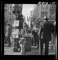 [Untitled photo, possibly related to: Corner of Montgomery and Market Streets, Monday morning, after Japanese attack on Pearl Harbor. San Francisco, California]. Sourced from the Library of Congress.