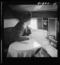 [Untitled photo, possibly related to: Passengers aboard an American airliner]. Sourced from the Library of Congress.