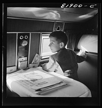 [Untitled photo, possibly related to: Passengers aboard an American airliner enroute from Washington to Los Angeles]. Sourced from the Library of Congress.