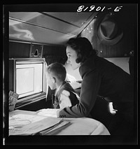 Passengers aboard an American airliner enroute from Washington to Los Angeles. Sourced from the Library of Congress.