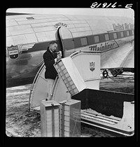 Omaha, Nebraska. Loading food on a United airliner. Sourced from the Library of Congress.