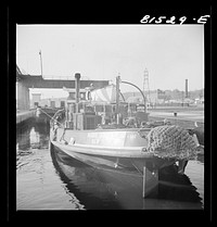 [Untitled photo, possibly related to: Tug pulling barges through Lock Eleven. Erie Canal, New York]. Sourced from the Library of Congress.
