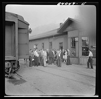 [Untitled photo, possibly related to: Richwood, West Virginia. Station scene at departure of men to help in the harvest in upper New York state]. Sourced from the Library of Congress.