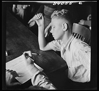 Richwood, West Virginia. Sixteen year old high school boy making a contract to help in the harvest in upper New York state. Sourced from the Library of Congress.