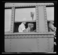 [Untitled photo, possibly related to: Richwood, West Virginia. Trainload of migratory workers bound for the harvest fields in New York state]. Sourced from the Library of Congress.