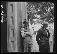 Summersville, West Virginia. Gossiping in the courthouse door. Sourced from the Library of Congress.