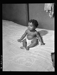 Bridgeton, New Jersey. FSA (Farm Security Administration) agricultural workers' camp. Migrant baby. Sourced from the Library of Congress.