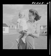 Radford, Virginia. Mrs. M.B. Henderson, wife of a defense worker, and their daughter, who live in Sunset Village FSA (Farm Security Administration) project. Sourced from the Library of Congress.