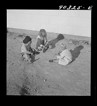 Children of defense workers playing outside their homes in Sunset Village. Radford, Virginia. FSA (Farm Security Administration) project. Sourced from the Library of Congress.