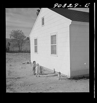 Children of defense workers playing outside their home in Sunset Village, FSA (Farm Security Administration) housing project. Radford, Virginia. Sourced from the Library of Congress.