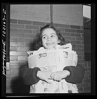Washington, D.C. Scrap salvage campaign, Victory Program. Washington schoolchild brings a load of scrap paper to school once a week. Here it is collected by paper company truck. Sourced from the Library of Congress.