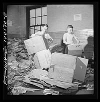 [Untitled photo, possibly related to: Washington, D.C. Scrap salvage campaign, Victory Program. Washington schoolchildren fold cartons so that they will pack flat and can be tied in bundles which are collected by paper company truck once a week]. Sourced from the Library of Congress.