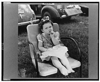 St. Mary's County, Maryland. Sunday school picnic on the edge of the Patuxent River. Reverend Jenkins' daughter getting enough to eat. Sourced from the Library of Congress.