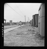 [Untitled photo, possibly related to: Arlington, Virginia. FSA (Farm Security Administration) trailer camp project for es. The project is situated right next to a school]. Sourced from the Library of Congress.