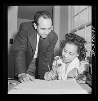 Arlington, Virginia. FSA (Farm Security Administration) trailer camp project for es. Manager of the project going over rental plan with his secretary. Sourced from the Library of Congress.