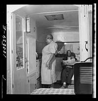 [Untitled photo, possibly related to: Arlington, Virginia. FSA (Farm Security Administration) trailer camp project for es. Interior of a single type trailer showing cooking facilities and couch which can be converted into a bed]. Sourced from the Library of Congress.