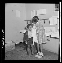 [Untitled photo, possibly related to: Arlington, Virginia. FSA (Farm Security Administration) trailer camp project for es. Washing facilities in the community building]. Sourced from the Library of Congress.