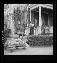 [Untitled photo, possibly related to: Schoolboys go voluntarily from house to house collecting scrap paper in connection with the campaign in the District schools. Washington, D.C.]. Sourced from the Library of Congress.