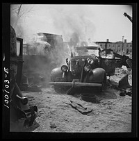 Washington, D.C. Scrap salvage campaign, Victory Program. After saleable parts are removed from old cars, the cars are burned in order to strip them of useless materials and to obtain metal skeleton for scrap. Sourced from the Library of Congress.